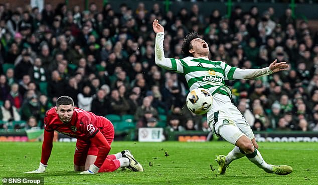 Motherwell goalkeeper Aston Oxborough concedes a penalty for a foul on Hyun-jun Yang