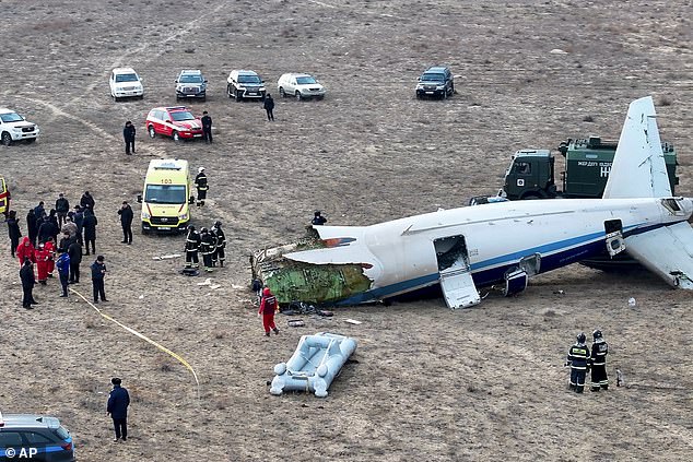 The wreckage of the Kazakhstan Airlines Embraer 190 lies on the ground near the airport in Aktau, Kazakhstan, on Wednesday, December 25.