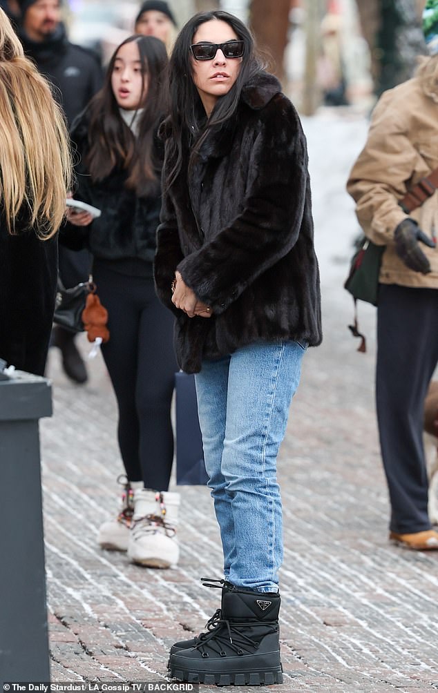 Alfallah rocked a fluffy black coat, as well as a pair of classic blue denim jeans and Prada boots to help keep her warm in the winter weather.