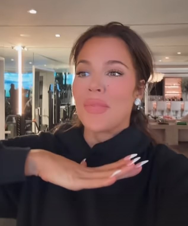 The Keeping Up with the Kardashians star updated more than 305 million followers on her holiday happenings while working out in a black hoodie.