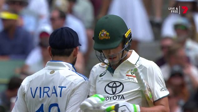 The moment Kohli (left) shoulder-bumps Sam Konstas (right) as the 19-year-old raced to an impressive 60 on his Boxing Day Test debut.