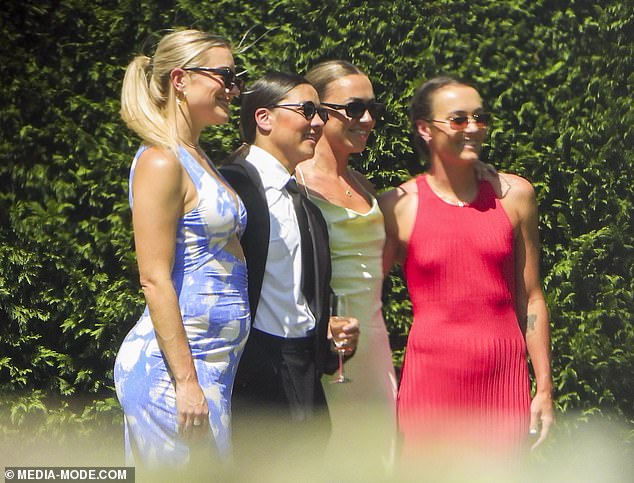 Emily Van Egmond's teammates were on hand with Kerr (second from left) posing for snaps with teammate Kristie Mewis (left). Arsenal star Katie McCabe (second from right) and Caitlin Foord (right) joined the pair for a photo.