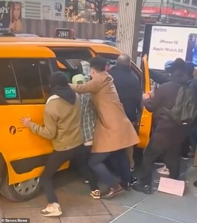 Passers-by rushed to help free the couple by manually pushing the taxi after Ms Stewart's husband began screaming for help.