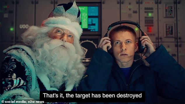 The dark video then shows a missile operator sitting with Grandpa Frost, a Russian version of Santa Claus (pictured).