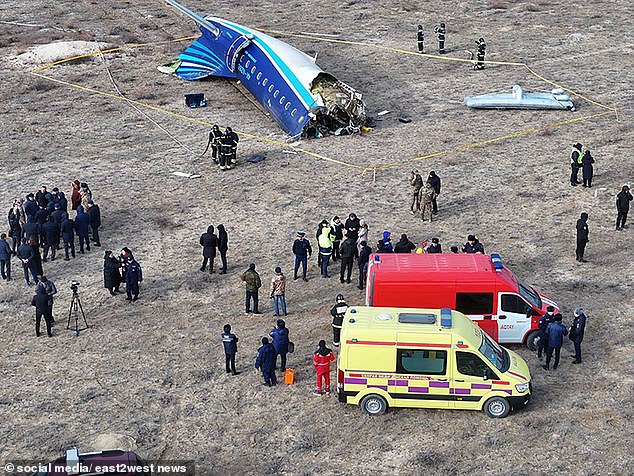 Emergency services are shown above at the scene of the plane crash.