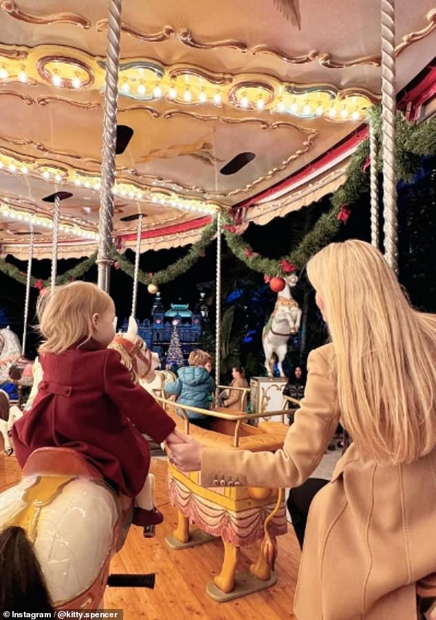 One sweet image showed mother and daughter taking a ride on a children's carousel at an amusement park in the glitzy European enclave.