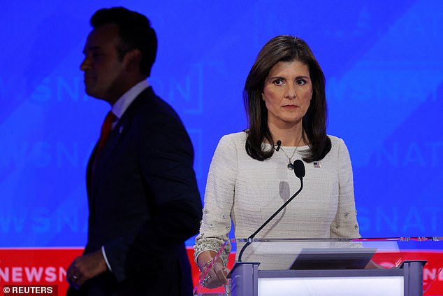 Republican presidential candidate and former U.S. Ambassador to the United Nations Nikki Haley looks on as fellow businessman candidate Vivek Ramaswamy passes by.