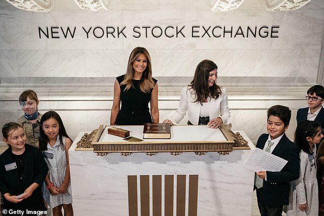 Instead of making stylistic waves, she opted for cautious predictability in her choice of an all-business black, sleeveless, figure-hugging Prada midi dress. (Image: First Lady Melania Trump at the New York Stock Exchange on September 23, 2019)