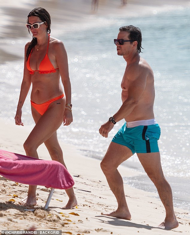 The 53-year-old actor and 46-year-old model showed off their impressively fit figures in barely-there swimsuits.