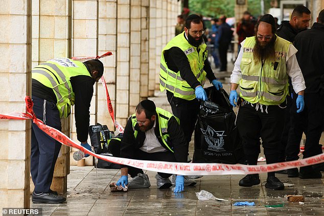 Emergency service workers at the scene in Herzliya, outside Tel Aviv, earlier today.