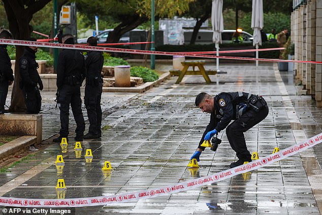 Israeli police search the scene of the stabbing attack, which was allegedly carried out by a former Shin Bet informant turned Palestinian terrorist.