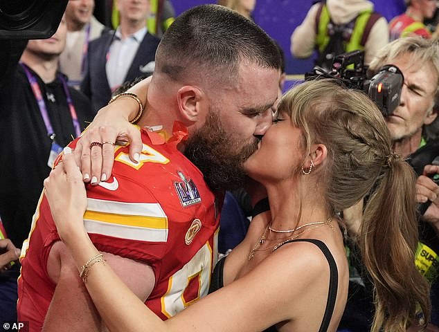 The superstar couple are big fans of PDA and are pictured here kissing at a Kansas City Chiefs game earlier this year in February.