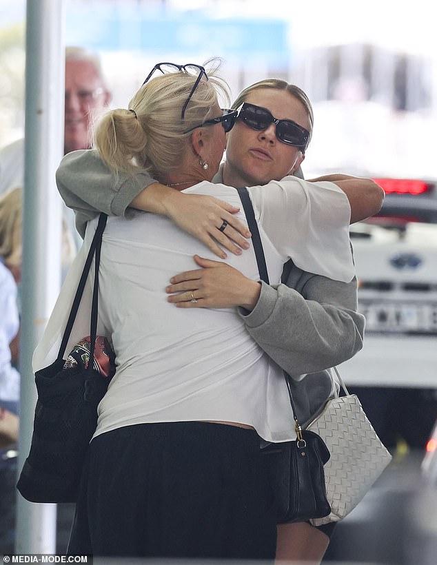 Sam's partner Kristie showed her support for the family as she hugged Roxanne as she said goodbye at the airport.