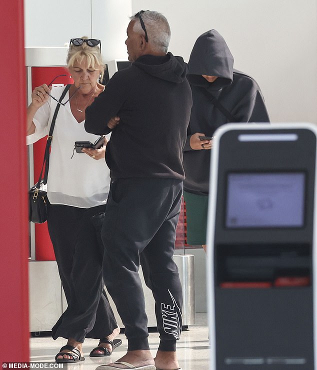 Sam and his parents were seen supporting each other as they arrived at the airport to catch their flight.