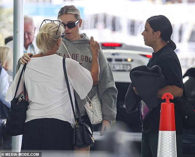 Sam was seen waiting and watching as Kristie and her mother Roxanne shared a sweet moment.