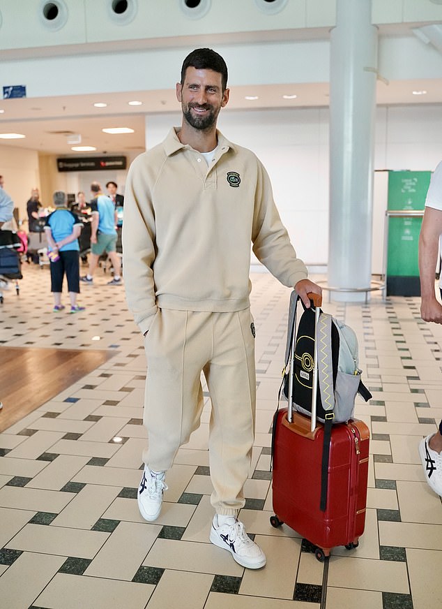 Djokovic cut an athletic figure in a beige tracksuit set, consisting of a polo-style sweater and matching sweatpants, to stay comfortable on his travels.