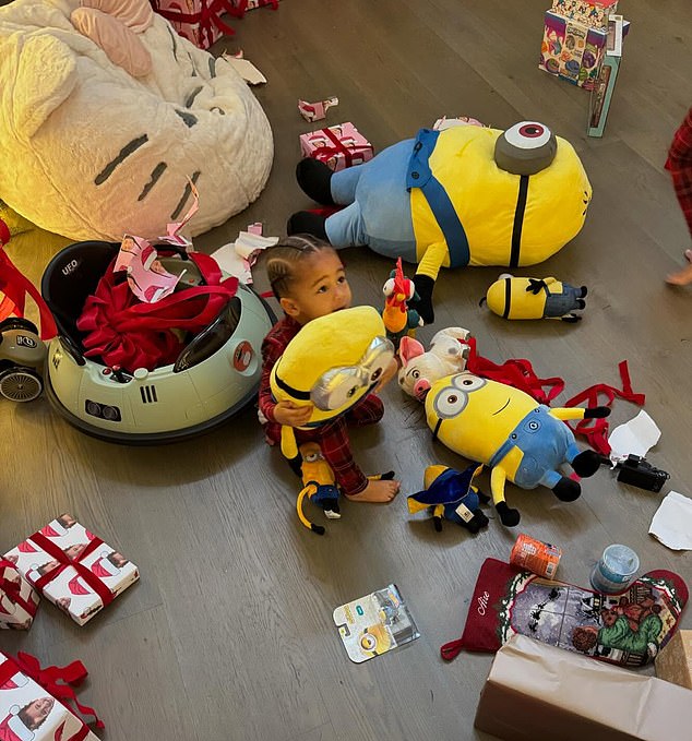 On Instagram, the Kardashians star, 27, posted a photo of Aire snuggling with a Minion plush while surrounded by open gifts and toys.