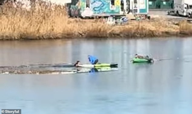 The 28-year-old woman can be seen pulling the troubled man towards the front of her paddleboard as she successfully rescues the unidentified man.