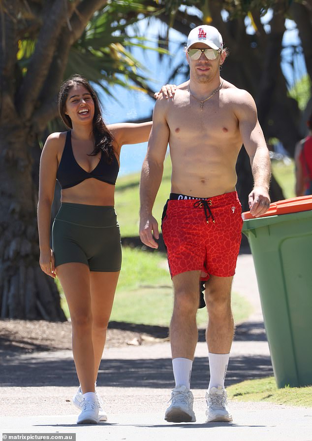 Meanwhile, Jayden's mystery date put on a busty display in a plain black bikini top and gray gym shorts that showed off her figure.