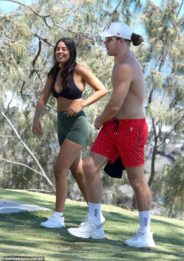 The pair seemed comfortable in each other's company with Jayden's apparent 'date' extending her arm to place over his bare shoulder as they strolled.