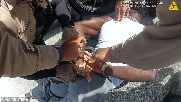 The wide receiver was pinned to the ground by officers prior to the Dolphins' season opener