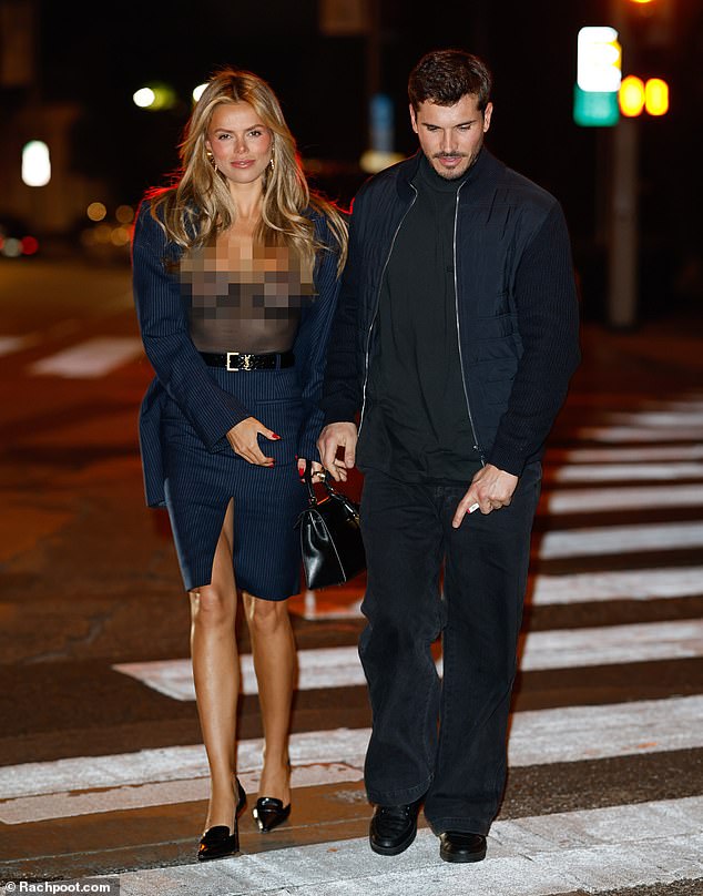 Brooks paired her X look with a striped jacket and matching skirt with a daring slit in the front.