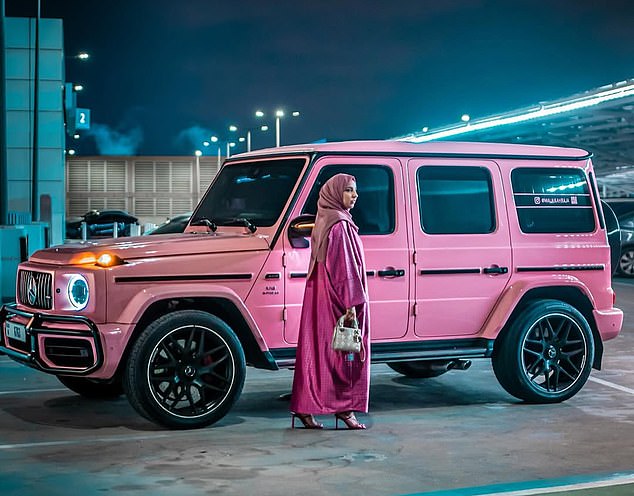 The couple live in a £2 million luxury home in an exclusive gated community in Dubai which they recently purchased. In the photo: Mrs. Raja with her luxurious pink Mercedes G-Wagon