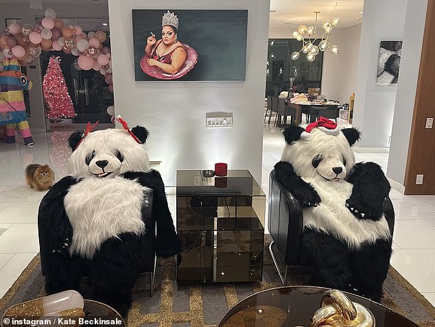 He also shared a photo of two giant panda bears wearing Christmas hats and sitting on his furniture.