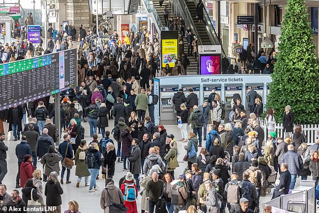 Off the rails: Unable to return home from London Paddington, Jeff cycled to a crowded Waterloo, above