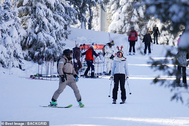 The 34-year-old actress turned Oxford University student was in a festive mood as she enjoyed a break with friends at a popular alpine resort.