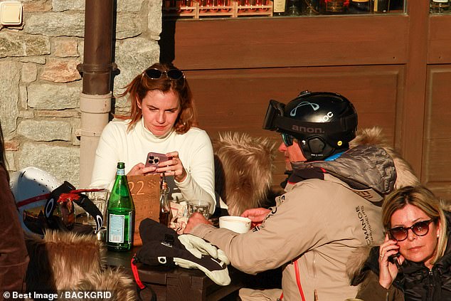 He seemed to be in great spirits as he took a well-deserved break at a nearby cafe with other skiers.