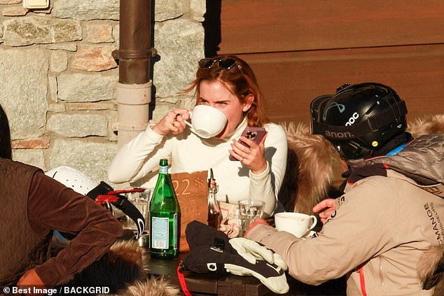 The Harry Potter star was seen enjoying a hot drink while taking a break from skiing.