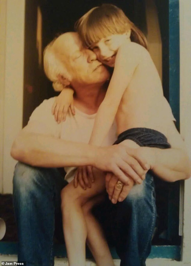 Katie with her father Arthur as a child. He found his father's photo while looking at his old house on Google Maps, using the site's historic Street View images.