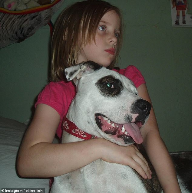 Billie also shared a throwback photo of herself as a little girl with one of her dogs