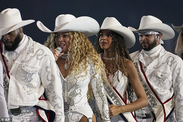 Beyonce performs with her daughter Blue Ivy at a football game between the Baltimore Ravens and the Houston Texans on Christmas Day.