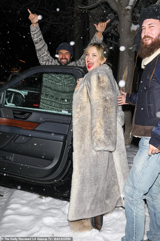 The 45-year-old actress was seen bundling up to combat the 31-degree weather as she laughed alongside her partner Danny Fujikawa and brother Oliver Hudson, among other family members.