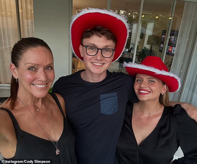 Showing off their pearly whites, the trio snuggled close for several Instagram photos, with other images showing a festive celebration at their family home. Pictured with Angie