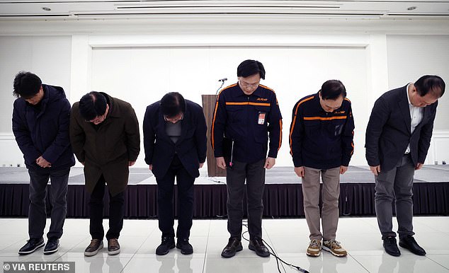 Jeju Air CEO Kim E-bae and officials bow to apologize for the incident involving their plane at Muan International Airport while holding a press conference in Seoul, South Korea