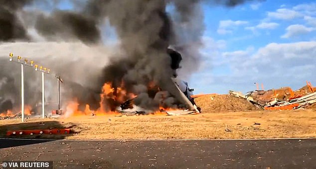 Firefighters carry out extinguishing work on an aircraft that has gone off the runway