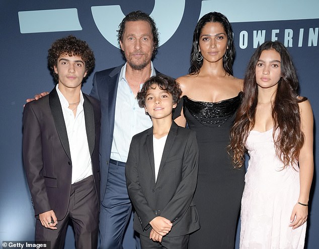 The Oscar winner, 55, took to Instagram on Saturday and posted two heartwarming snaps of their father-son bond at a University of Texas football game, McConaughey's alma mater; ((LR) Levi McConaughey, Matthew McConaughey, Livingston McConaughey, Camila Alves McConaughey and Vida McConaughey in April 2024)