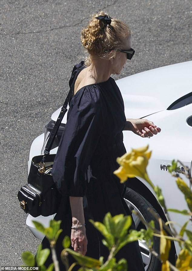 She added a pair of satin Mary Jane flats and wore a ribbon in her strawberry blonde curls in the same fabric.