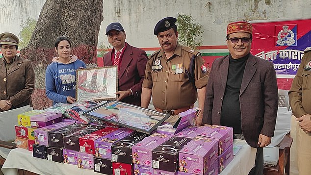 Charity workers visiting the institution to distribute gifts for the festive season are then filmed and presented with some of Mann's elaborate paintings.