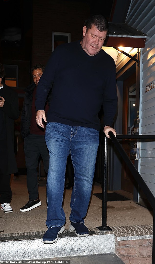 The 57-year-old was dressed casually in a navy blue jumper that hugged his slender figure. The former Crown Resorts president added a pair of blue jeans and sneakers.