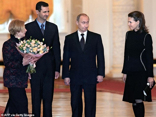 Bashar and Asma Al-Assad are pictured meeting with Vladimir Putin in 2005