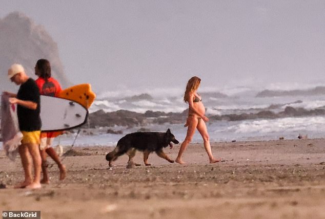 The catwalk star walked barefoot along the coast