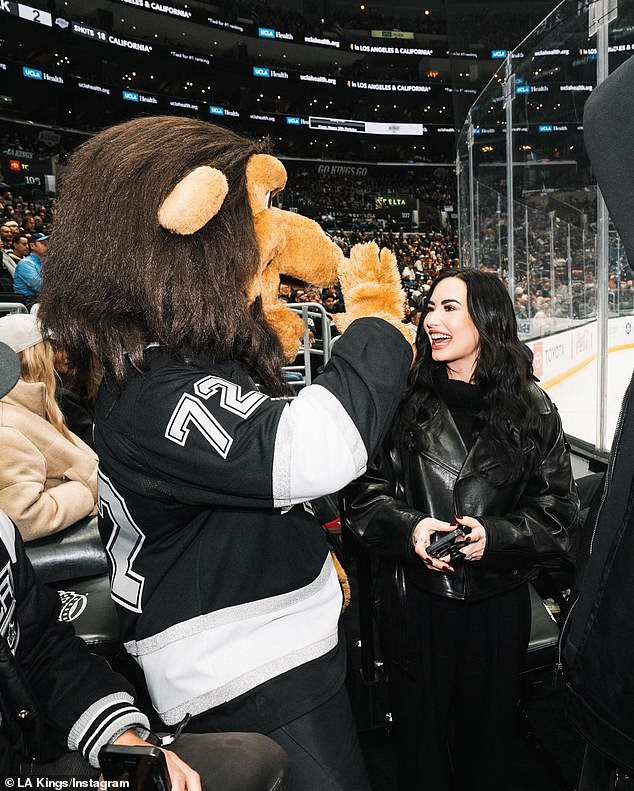 Kings mascot Bailey made a big deal of Demi, hugging her, posing for photos with her and calling Demi her number one fan in a subsequent Instagram post.