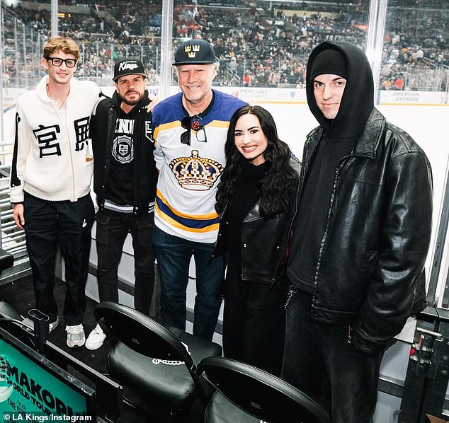 She attended the game with her fiance Jutes and friend Dave Osokow and they were sitting near Will Ferrell 57 and his son Magnus right behind the glass.