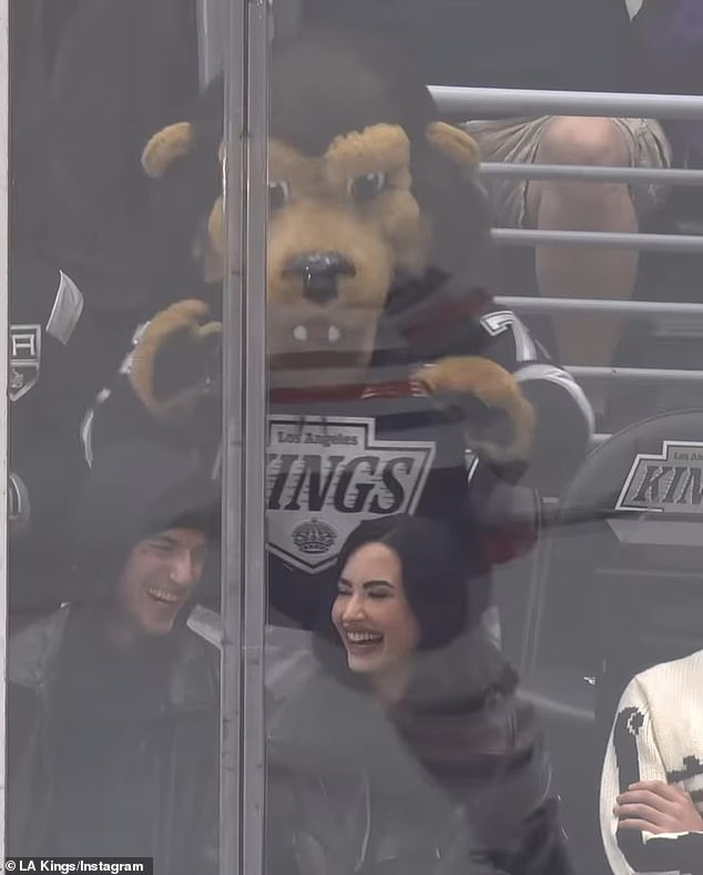 The joyful group watched the Kings defeat the Edmonton Oilers 4-3 in overtime.