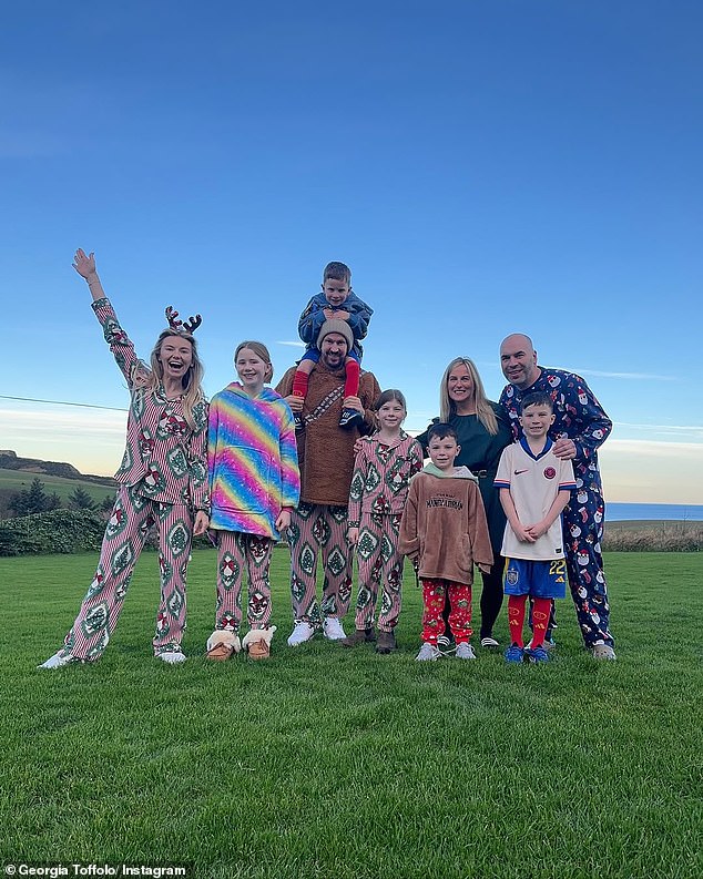 Georgia, who rose to fame in Made In Chelsea, also shared photos of the family in matching pajamas while on top of a hill.