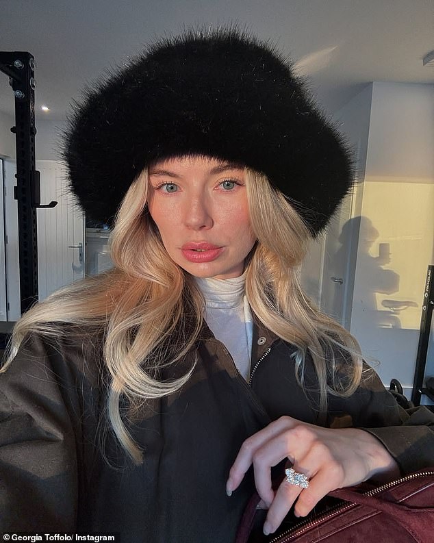 In another photo, Georgia showed off her massive flare as she posed in a fluffy black hat and let her blonde locks fall freely over her shoulders.